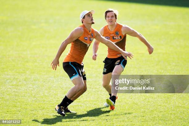 Sam Powell-Pepper and Jared Polec of the Power compete during a Port Power AFL training session at the Adelaide Oval on August 31, 2017 in Adelaide,...