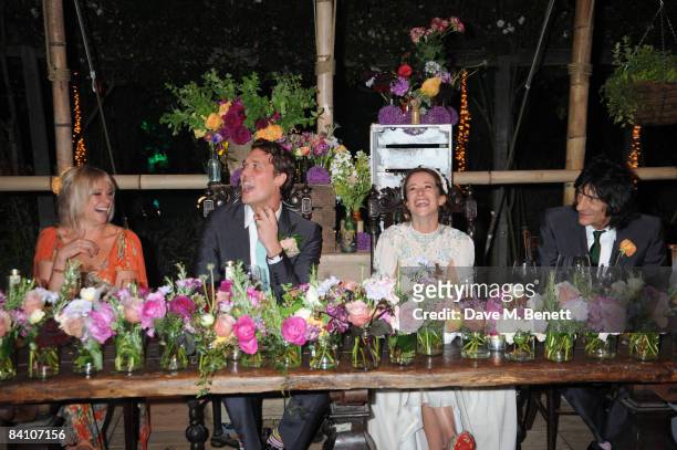 Leah Wood and Jack MacDonald with Jo Wood and Ronnie Wood attend their wedding reception dinner at HolmWood on June 21, 2008 in Kingston, London,...