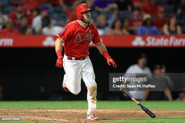 Cliff Pennington of the Los Angeles Angels runs to first base after hitting a grandslam homerun during the seventh inning of a game against the...