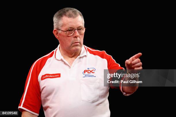 John MaGowan celebrates winning a leg in the first round match between Chris Mason of England and John MaGowan of Northern Ireland during the 2009...