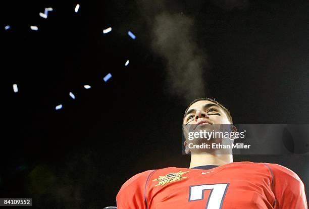 Quarterback Willie Tuitama of the Arizona Wildcats looks out at fans as he celebrates the team's 31-21 victory over the Brigham Young University...