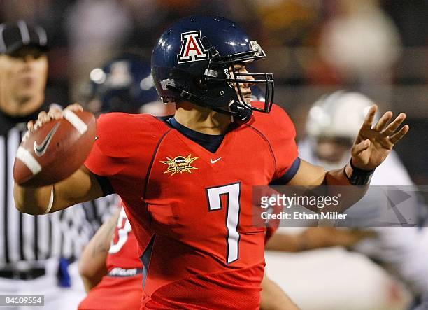 Quarterback Willie Tuitama of the Arizona Wildcats looks to throw a pass against the Brigham Young University Cougars during the Pioneer Las Vegas...