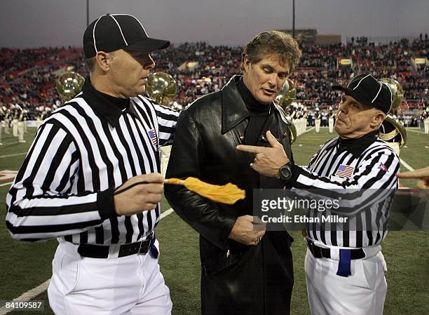 Actor David Hasselhoff jokes with referees Danny Worrell and Tommy Pace before Hasselhoff sang the American national anthem at the Pioneer Las Vegas...