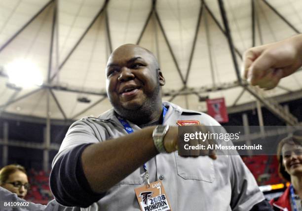 Miller High Life beer spokesman Windell Middlebrooks checks the sidelines as the Atlanta Falcons host the Tampa Bay Buccaneers at the Georgia Dome on...