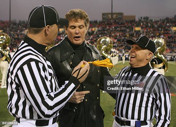 Actor David Hasselhoff jokes with referees Danny Worrell and Tommy Pace before Hasselhoff sang the American national anthem at the Pioneer Las Vegas...