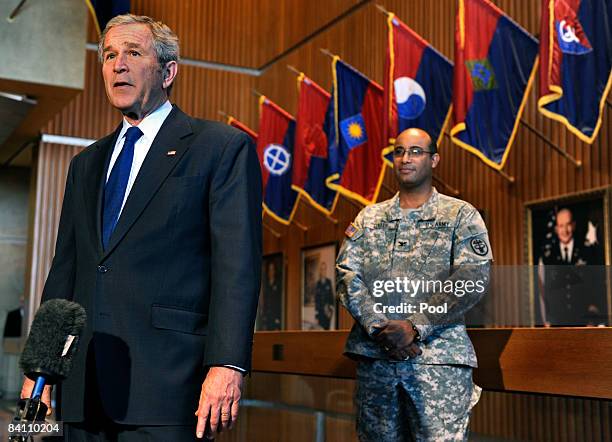 President George W. Bush makes remarks to the press in front of U.S. Army Col. Norvell V. Coots, commander of Walter Reed Army Medical center,...