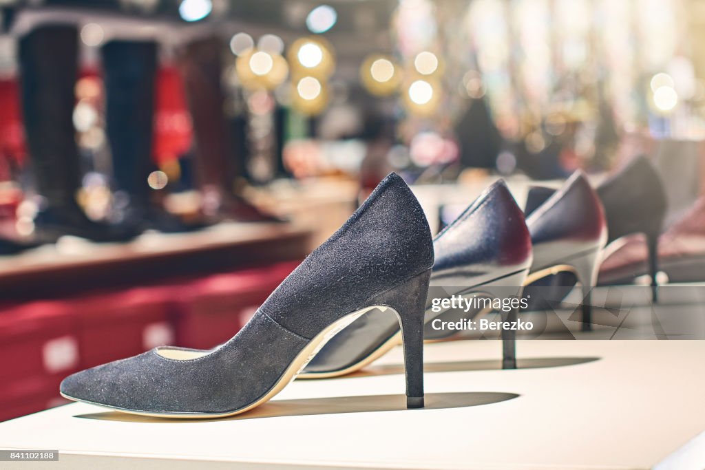 Elegant black woman shoes in a luxury store