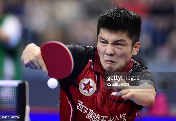 Fan Zhendong of China competes in the Men's Team second stage matches of the 13th Chinese National Games at Wuqing sport center on August 30, 2017 in...