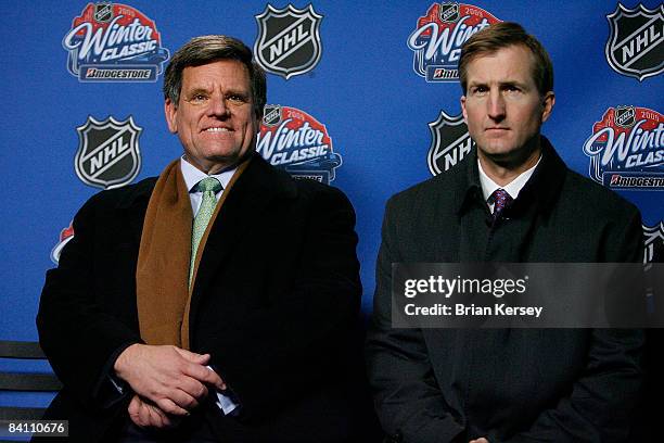 Chicago Blackhawks chairman Rocky Wirtz and Chicago Cubs chairman Crane Kenney sit together during a news conference at Wrigley Field on December 22,...