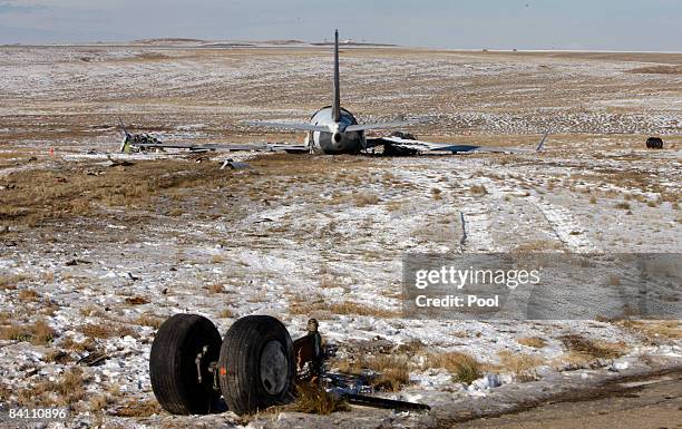 The wreckage of a Continental Airlines twin-engine Boeing 737-500 plane, Flight 1404, including landing gear, sits in a ravine December 22, 2008 in...