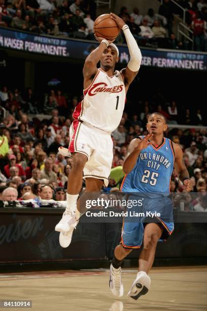 Daniel Gibson of the Cleveland Cavaliers goes up for a shot over Earl Watson of the Oklahoma City Thunder during the game on November 26, 2008 at...