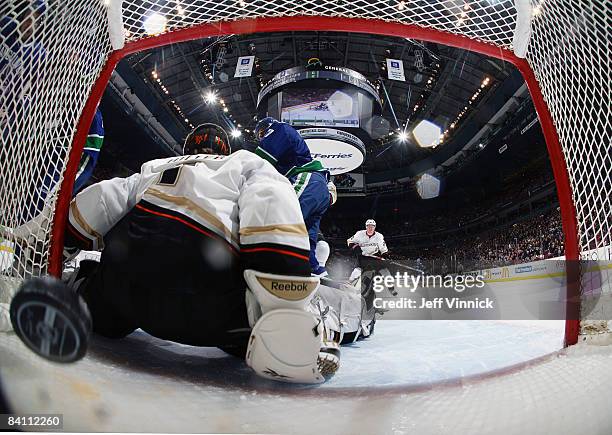 Mason Raymond of the Vancouver Canucks gets a shot by Jonas Hiller of the Anaheim Ducks during their game at General Motors Place on December 22,...