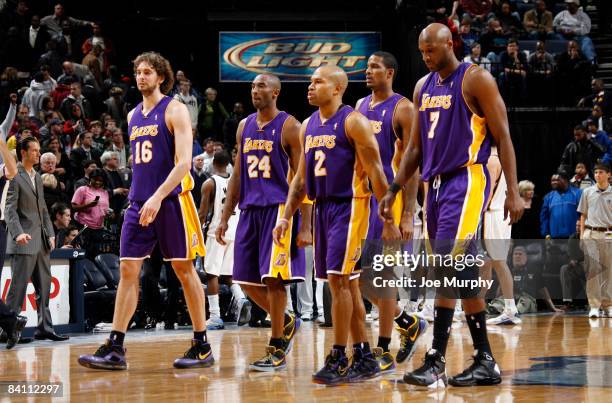 Pau Gasol, Kobe Bryant, Trevor Ariza, Derek Fisher and Lamar Odom of the Los Angeles Lakers walk off the court for a timeout in a game against the...