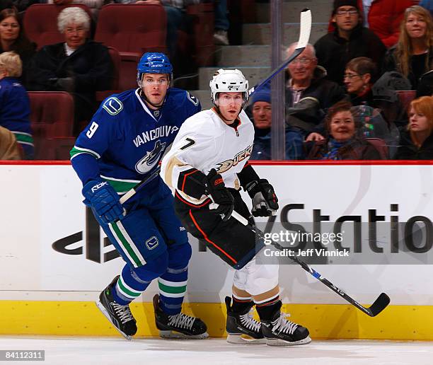 Brendan Morrison of the Anaheim Ducks skates by former teammate Taylor Pyatt of the Vancouver Canucks during their game at General Motors Place on...