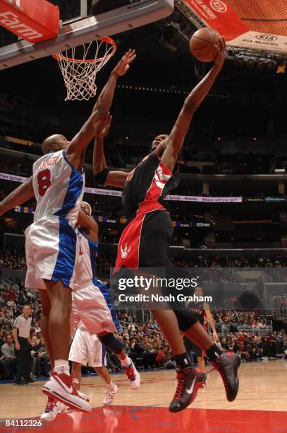 Chris Bosh of the Toronto Raptors has his shot challenged by Brian Skinner of the Los Angeles Clippers at Staples Center on December 22, 2008 in Los...