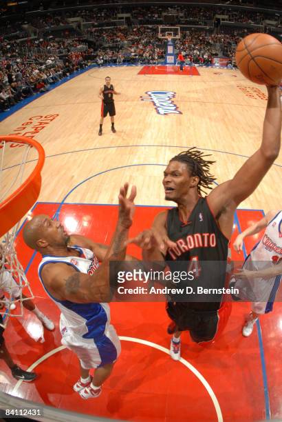 Chris Bosh of the Toronto Raptors goes up for a dunk against Brian Skinner of the Los Angeles Clippers at Staples Center on December 22, 2008 in Los...