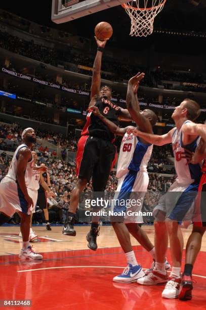 Jermaine O'Neal of the Toronto Raptors puts up a shot against Zach Randolph of the Los Angeles Clippers at Staples Center on December 22, 2008 in Los...