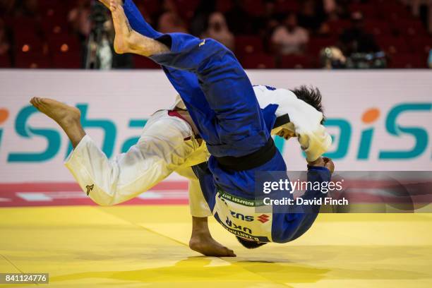Hifumi Abe of Japan throws former world champion, Georgii Zantaraia of Ukraine for a wazari and later an ippon on his way to the u66kg gold medal...