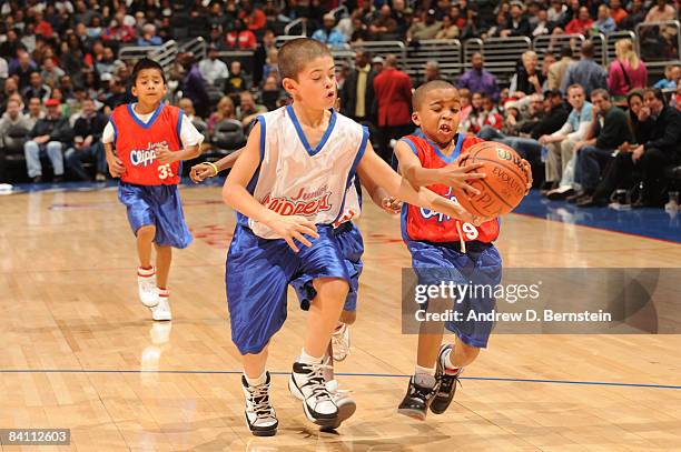 Members of the Jr. Clippers scrimmage during halftime of the game between the Toronto Raptors and the Los Angeles Clippers at Staples Center on...