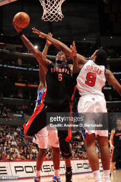 Jermaine O'Neal of the Toronto Raptors has his shot challenged by DeAndre Jordan of the Los Angeles Clippers at Staples Center on December 22, 2008...