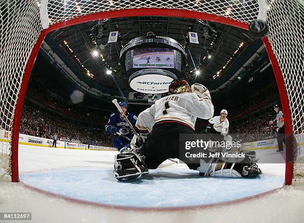 Daniel Sedin of the Vancouver Canucks gets a shot by Jonas Hiller of the Anaheim Ducks off a breakaway during their game at General Motors Place on...