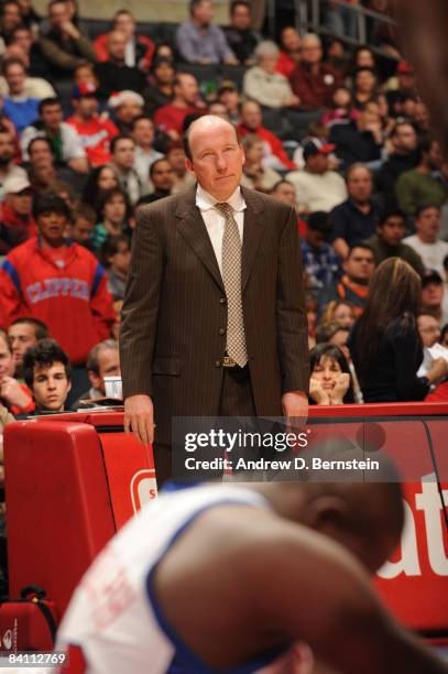 Head Coach Mike Dunleavy of the Los Angeles Clippers looks on while Zach Randolph tends to his knee during a game against the Toronto Raptors at...