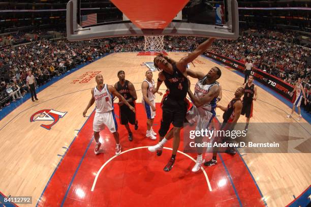 Chris Bosh of the Toronto Raptors has his shot challenged by DeAndre Jordan of the Los Angeles Clippers at Staples Center on December 22, 2008 in Los...