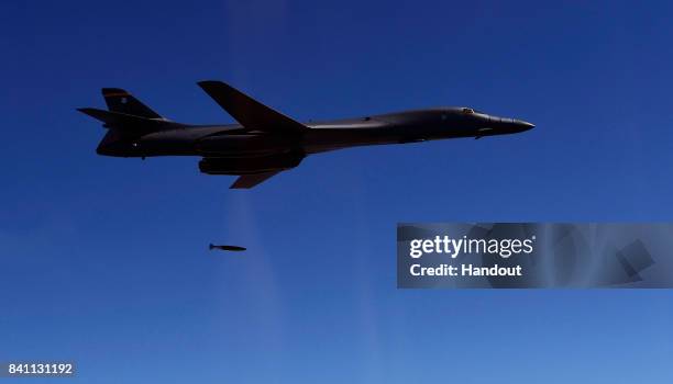In this handout image provide by South Korean Defense Ministry, A U.S. Air Force B-1B Lancer bomber drops a bomb during a training at the Taebaek...