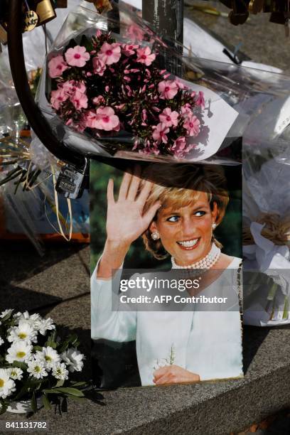 Picture taken on August 31, 2017 at the Flame of Liberty monument over the Alma bridge in Paris - which became an unofficial memorial for Diana,...