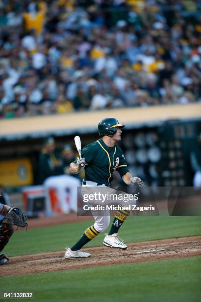 Jaycob Brugman of the Oakland Athletics bats during the game against the San Francisco Giants at the Oakland Alameda Coliseum on July 31, 2017 in...