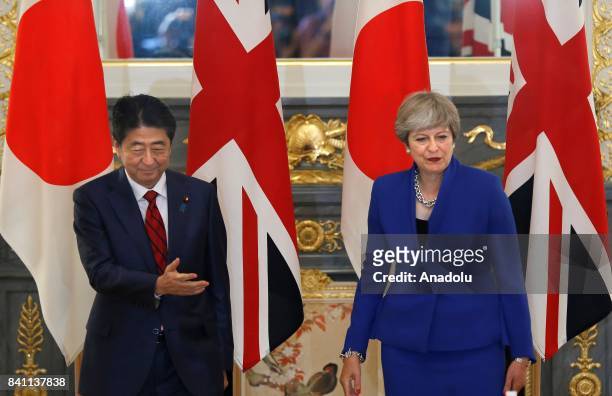 British Prime Minister Theresa May is greeted by her Japanese counterpart Shinzo Abe prior to a meeting at the Akasaka Palace State Guest House in...