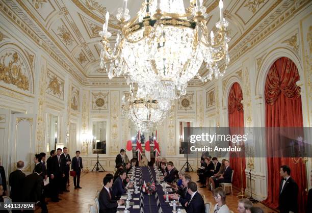 British Prime Minister Theresa May talks with her Japanese counterpart Shinzo Abe during their meeting at the Akasaka Palace State Guest House in...