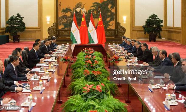 Chinese President Xi Jinping with Tajikistan's President Emomali Rahmon during their meeting at the Great Hall of the People in Beijing, China, 31...
