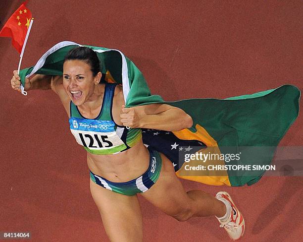Brazil's Maurren Higa Maggi celebrates after winning the women's Long Jump final at the National Stadium during the 2008 Beijing Olympic Games on...