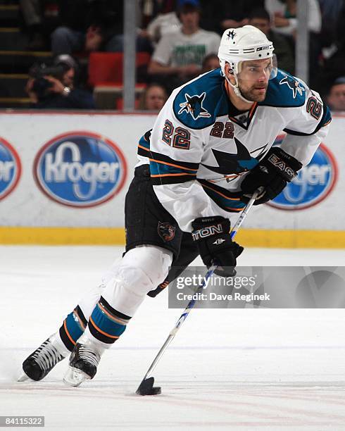 Dan Boyle of the San Jose Sharks skates with the puck during a NHL game against the Detroit Red Wings on December 18, 2008 at Joe Louis Arena in...