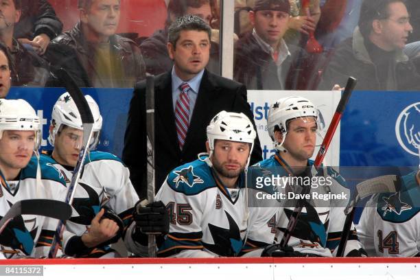 Head coach Todd McLellan of the San Jose Sharks looks over the bench during a NHL game against the Detroit Red Wings on December 18, 2008 at Joe...