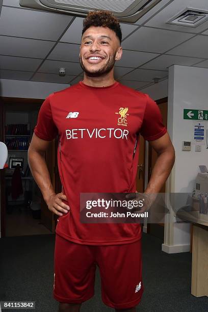 Liverpools New Signing Alex Oxlade-Chamberlain puts on his new training kit for the first time at St Georges Park on August 30, 2017 in...