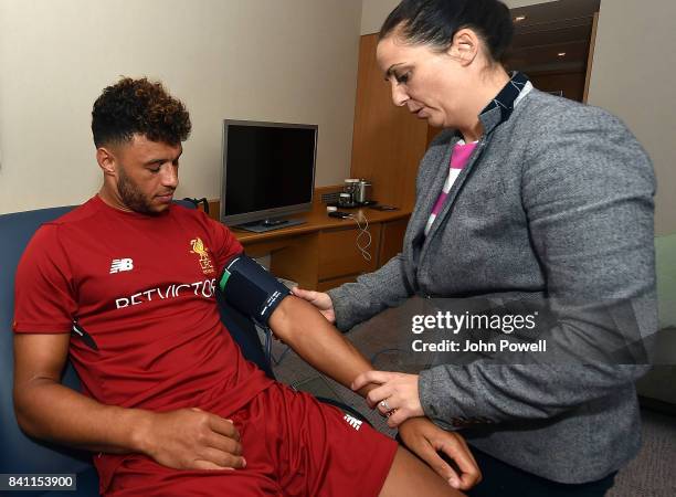 Liverpools New Signing Alex Oxlade-Chamberlain has his medical from Sarah Massey at St Georges Park on August 30, 2017 in Burton-upon-Trent, England.