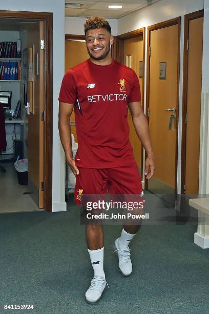 Liverpools New Signing Alex Oxlade-Chamberlain puts on his new training kit for the first time at St Georges Park on August 30, 2017 in...