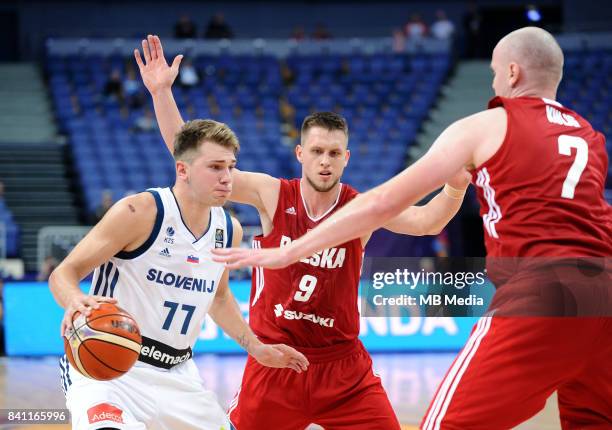 Luka Doncic of Slovenia Mateusz Ponitka Damian Kulig of Poland during the FIBA Eurobasket 2017 Group A match between Slovenia and Poland on August...