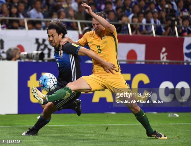 Japan's forward Shinji Okazaki fights for the ball with Australia's midfielder Brad Smith during the group B World Cup 2018 qualifying football match...