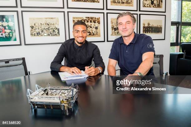 Jeremy Toljan signs a new contract with Borussia Dortmund with Michael Zorc on August 30, 2017 in Dortmund, Germany.