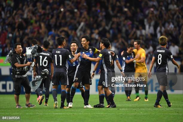 Makoto Hasebe and Japan players celebrate their 2-0 victory and qualified for the FIFA World Cup Russia after the FIFA World Cup Qualifier match...