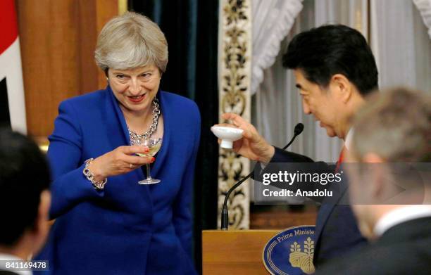 British Prime Minister Theresa May attends a welcome dinner which is hosted by Japanese Prime Minister Shinzo Abe at the Akasaka Palace State Guest...