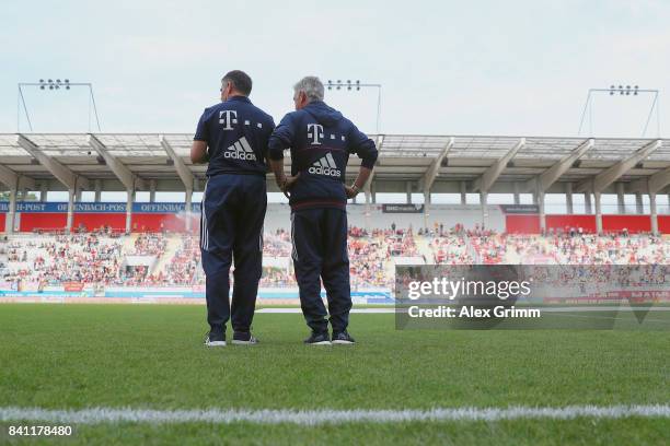 Head coach Carlo Ancelotti and assistant coach Willy Sagnol of Muenchen stand on the pitch prior to a friendly match between Kickers Offenbach and FC...