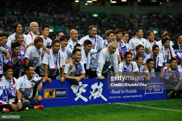 Japanese players and staffs celebrate their 2-0 victory and qualified for the FIFA World Cup Russia after the FIFA World Cup Qualifier match between...