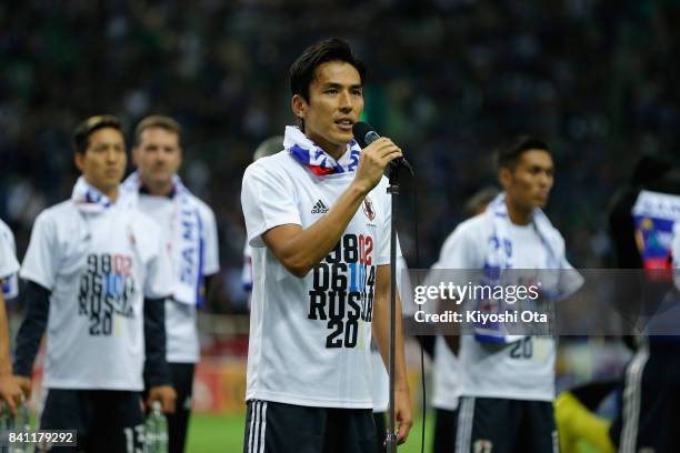 Captain Makoto Hasebe of Japan applauds supporters after his team's 2-0 victory and qualified for the FIFA World Cup Russia after the FIFA World Cup...