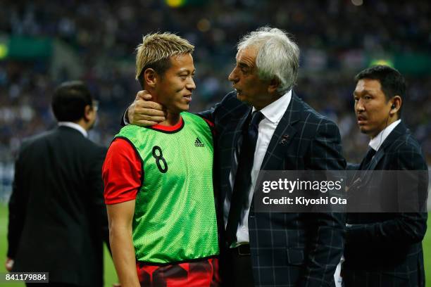 Head coach Vahid Halilhodzic of Japan talks to Keisuke Honda after his team's 2-0 victory and qualified for the FIFA World Cup Russia after the FIFA...