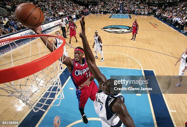 Al Thornton of the Los Angeles Clippers shoots a layup against DeSagana Diop of the Dallas Mavericks during the game at American Airlines Center on...