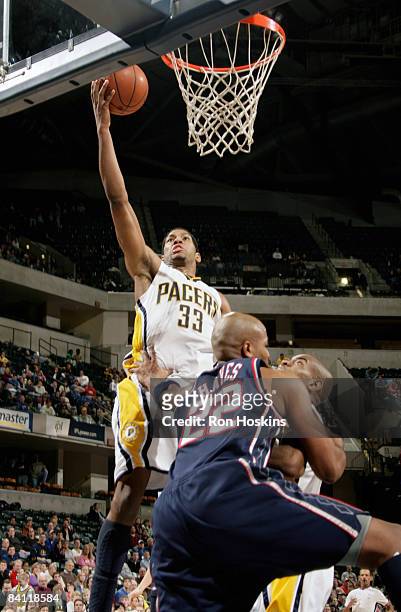 Danny Granger of the Indiana Pacers shoots over Jarvis Hayes of the New Jersey Nets at Conseco Fieldhouse December 23, 2008 in Indianapolis, Indiana....